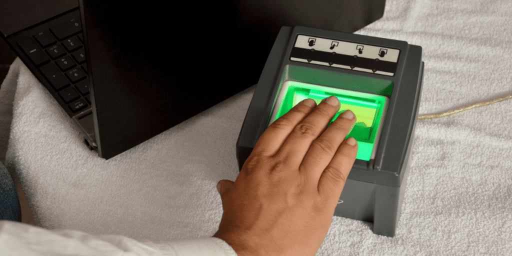 Finger print scanner in use featuring Why biometrics is growing in developing countries